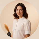 Circular portrait of Olivia Hart, a confident woman smiling gently against a warm cream background.