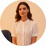 Circular portrait of Chloe Dupont, a diverse woman, with an elegant and confident expression. She is wearing a delicate fashi